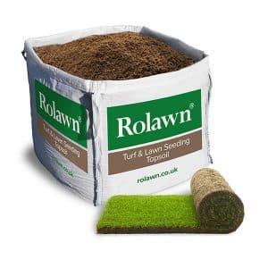 Rolawn Medallion Turf roll in front of a bulk bag of Turf and Lawn Seeding Topsoil